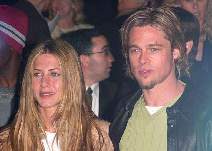 Brad Pitt with medium long dark blond hair in 90s